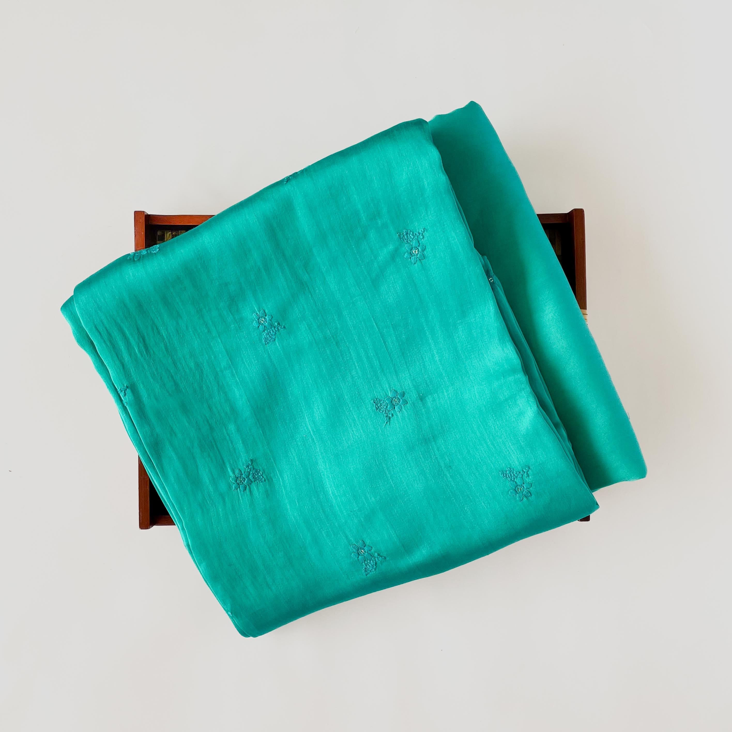 Bright Turquoise Dancing Daisies Embroidered Fine Munga Satin Fabric